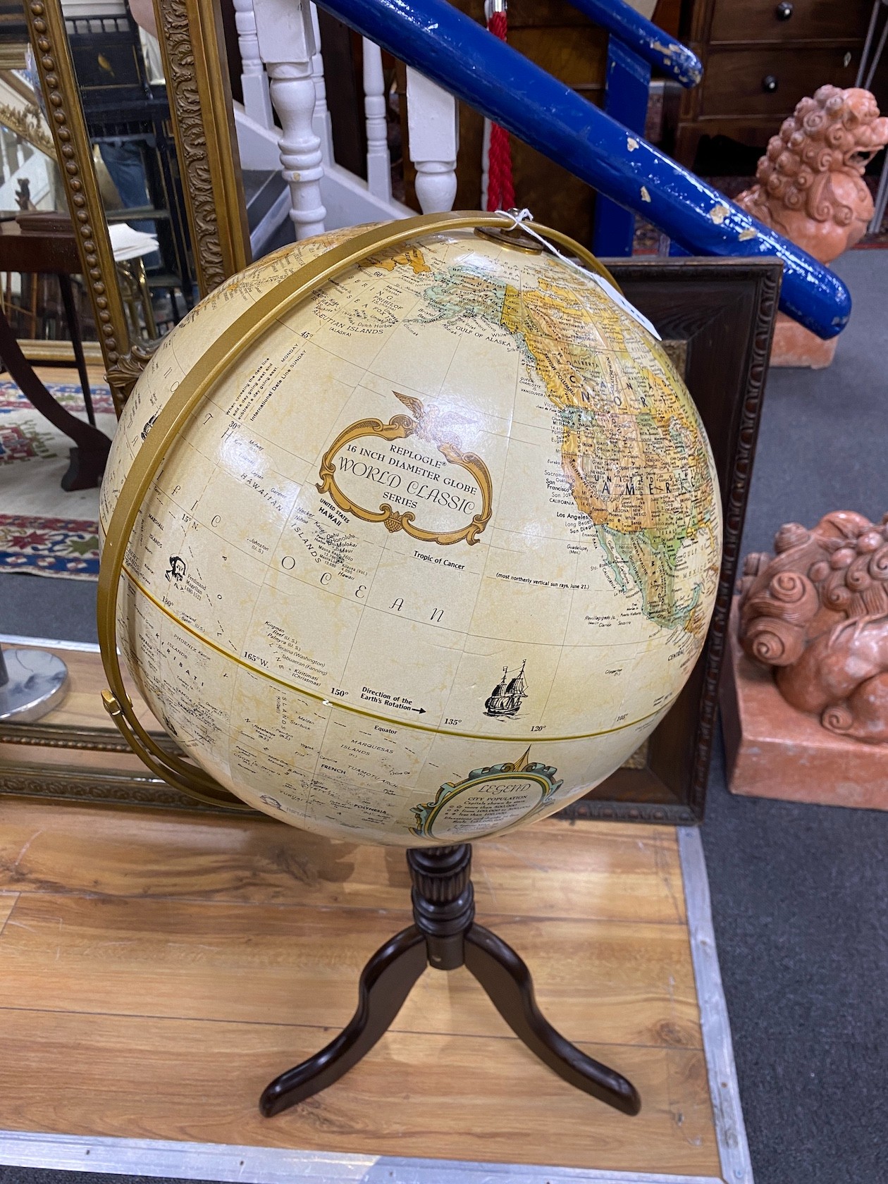 A Replogle 16inch terrestrial globe on tripod stand height 97cm.